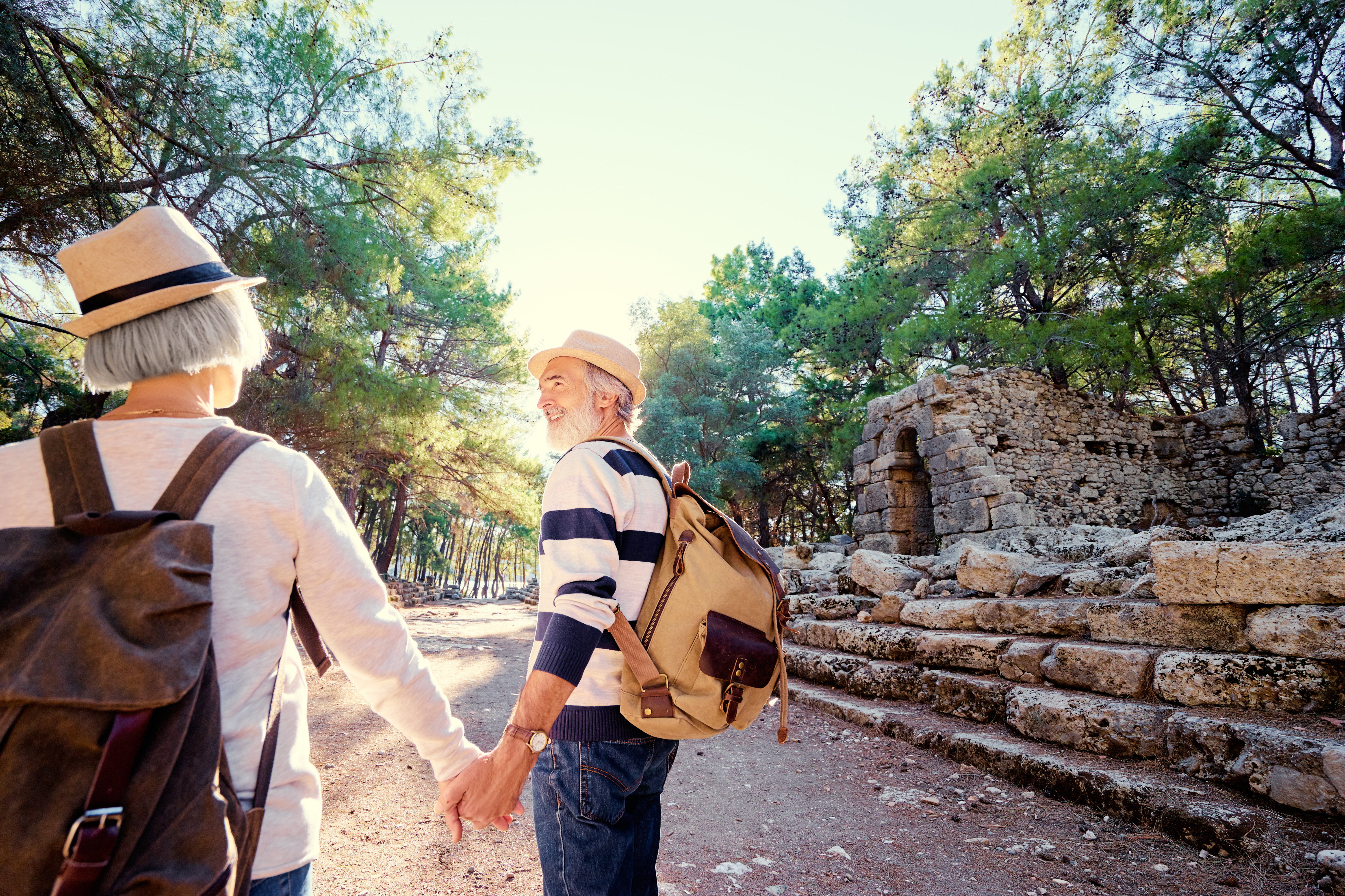 Travel and tourism. Senior family couple walking together on ancient sighseeing.