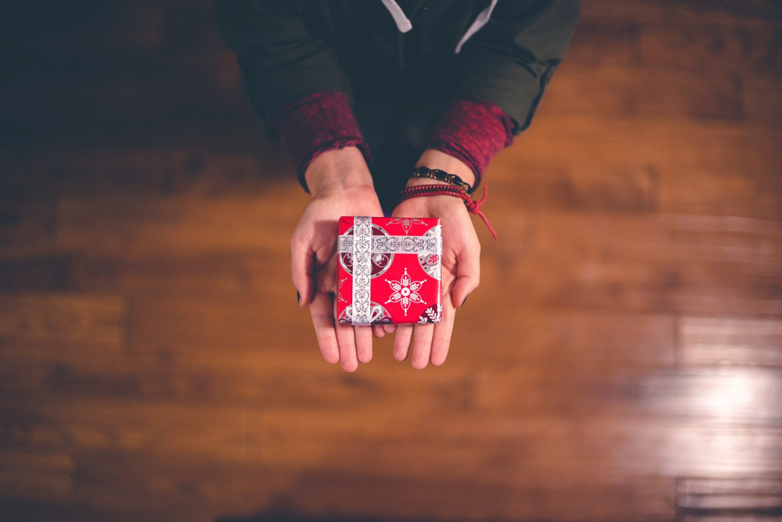 Hands holding a present.