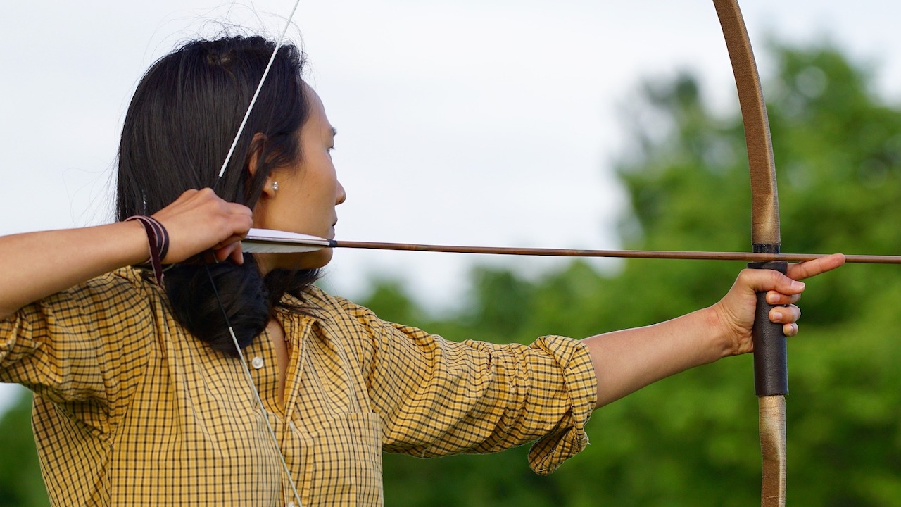 An archer aiming at a target.